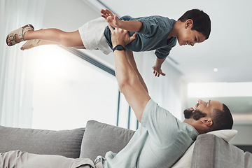 Image showing Relax, smile and lifting with father and son on sofa of living room for bonding, playful and support. Wellness, game and strong with dad and child in family home for care, quality time and happy