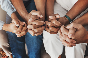 Image showing Family, hands and prayer in home for love, support and faith or hope in house. Praying religion, worship and group of people pray to God, holy spirit or Jesus for peace, praise and spiritual wellness