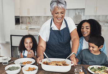 Image showing Grandmother, family home and kids at table for food, lunch or celebration with love, care and happiness. Black people, senior woman and children with dinner, party and happy for bonding in kitchen