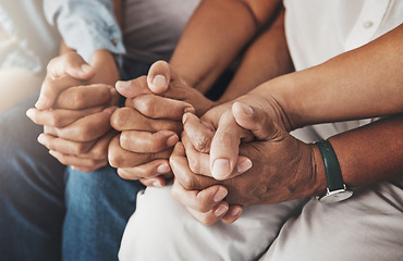 Image showing Family, holding hands and prayer in home for love, support and faith or hope in house. Praying religion, worship and group of people pray to God, holy spirit or Jesus for peace or spiritual praise.