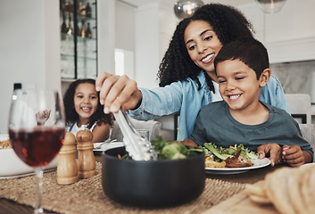 Image showing Mother, kids and eating food in home together for lunch, dinner table and healthy meal. Happy family, mom and children smile for dining in house with love, care and happiness of delicious supper