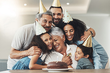 Image showing Family, happy birthday and hug portrait of senior woman at a table with a cake, love and care. Smile of children, parents and grandparents together for party to celebrate excited grandma with dessert