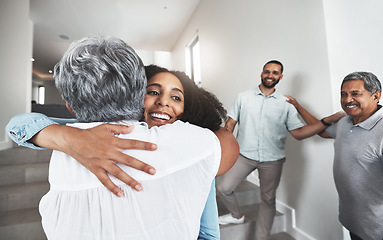 Image showing Family, hug or visit with a woman and senior mother hugging in a home together during a reunion. Love, bonding and happy with a mature female hugging her adult daughter while visiting in a home