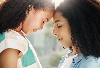 Image showing Family, mother and child with love and peace outdoor, forehead touching with embrace, calm and content. Relationship, trust and support, black woman and girl, motherhood and parenting with connection