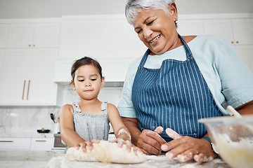 Image showing Learning, cooking dough and grandmother with girl in kitchen baking dessert or pastry. Education, family care and happy grandma teaching kid how to bake, bonding and enjoying quality time together.