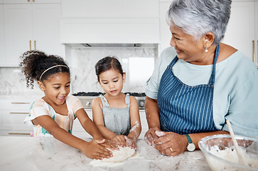 Image showing Learning, cooking dough and grandmother with kids in kitchen baking dessert or pastry. Education, family care and happy grandma teaching sisters or children how to bake, bonding and laughing together