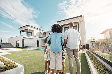 Image showing Love, new house and family in their backyard together looking at their property or luxury real estate. Embrace, mortgage and parents with their children on grass at their home or mansion in Canada.