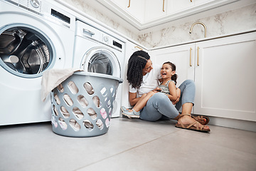 Image showing Mom, girl kid and basket by washing machine on floor for cleaning, bonding and comic laugh in house. Laundry, mother and daughter with happiness, love and care in family home with happy smile for hug