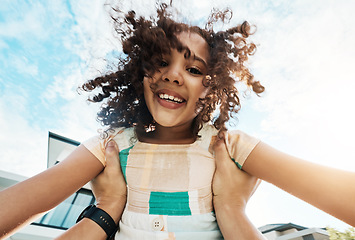 Image showing Portrait, children and pov with a black girl in the hands of her father outdoor in the garden of their home together. Love, fun or kids and a female child playing with a parent in the backyard