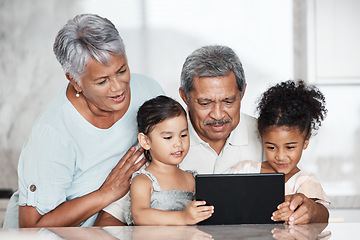 Image showing Learning, grandparents and kids with tablet in home, playing online games or educational app. Bonding, touchscreen or care of happy family watching movie, film or video on digital technology in house