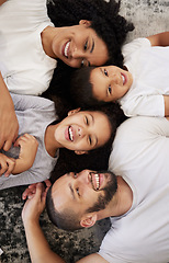 Image showing Above, family and portrait with children and parents on a floor, happy and relax while bonding in their home. Love, mother and kids with father on the ground for fun, laugh and playing in their house