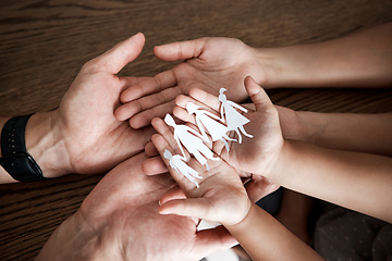 Image showing Hands, paper cutout family and house on table for sign, symbol or icon of support, love and solidarity. Art design with mother, father and children together for safety, trust and insurance in home