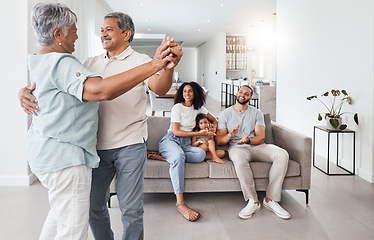 Image showing Senior couple, dancing and happy family with love, support and care together in home living room. Men, women and child or parents and grandparents in young for happy quality time and bonding in house