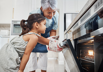 Image showing Cooking, learning and grandmother with girl by oven in kitchen baking delicious muffins. Education, development and happy grandma teaching kid how to bake, bonding and enjoying quality time together.