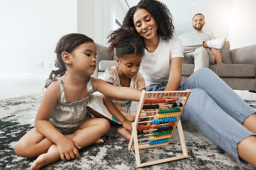 Image showing Mother, children and floor with abacus for math learning, teaching or sibling teamwork in family home. Kids, carpet and education toys with mom, dad and sofa with smile, pride and happiness in house