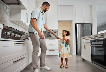 Image showing Family, father and girl dance in kitchen together for bonding, quality time and affection at home. Family, love and happy dad with girl dancing, smile and holding hands for fun, relaxing and carefree