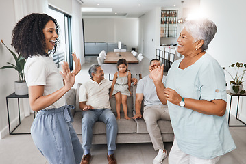 Image showing Happy family, mother and daughter dancing with love, support and care together in home living room. Women, men and child or parents and grandparents in lounge for happy quality time and bonding