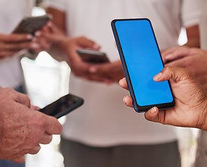 Image showing People, hands and green screen phone on mockup in networking, social media or communication for advertising. Hand of person on mobile smartphone with chromakey display for marketing or advertisement