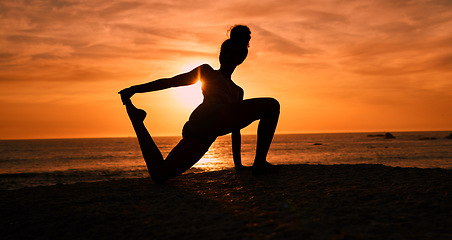 Image showing Meditation, yoga and silhouette of woman on beach at sunrise for exercise, training and pilates workout. Motivation, fitness and shadow of girl balance by ocean for sports, wellness and stretching