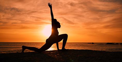 Image showing Pilates, yoga and silhouette of woman on beach at sunrise for exercise, training and fitness workout. Motivation, meditation and shadow of girl balance by ocean for sports, wellness and stretching