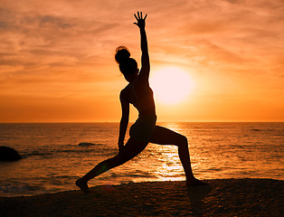 Image showing Yoga, exercise and silhouette of woman on beach at sunrise for fitness, training and pilates workout. Motivation, meditation and shadow of girl balance by ocean for sports, wellness and stretching