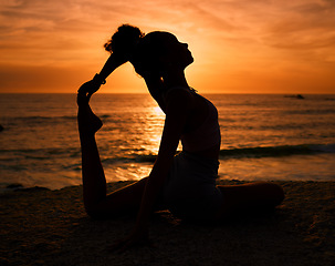 Image showing Pilates, yoga and silhouette of woman on beach at sunrise for exercise, training and fitness workout. Motivation, meditation and shadow of girl balance by ocean for sports, wellness and stretching
