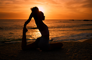 Image showing Pilates, yoga and silhouette of woman at sunrise on beach for exercise, training and pilates workout. Motivation, meditation and shadow of girl balance by ocean for sports, wellness and stretching