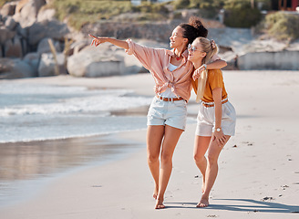 Image showing Couple hug on beach, lesbian and happy with ocean, gay women outdoor with adventure and freedom to love. Interracial relationship, sea view and holiday in Australia, lgbtq with travel and walking