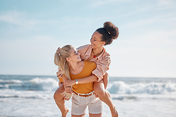 Image showing Piggyback, ocean and happy couple of friends for lgbtq, lesbian or love and freedom on summer vacation together. Blue sky, beach and diversity women on date, fun support or excited valentines holiday