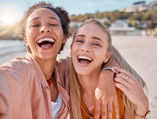 Image showing Selfie, excited and portrait friends at the beach for bonding, weekend and holiday in Miami. Happy, comic and women with a photo for vacation memory, travel and happiness hug by the sea in summer