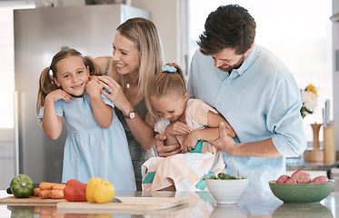 Image showing Portrait, playful and family cooking food, bonding and children helping in the kitchen for lunch. Happy, laughing and parents playing with girl kids while preparing dinner together for quality time