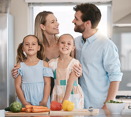 Image showing Parents, food and portrait of children cooking with vegetables for lunch, dinner or ingredients for meal prep. Family, smile and mom, dad and girls learning, teaching and helping at kitchen table