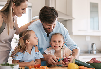 Image showing Children and parents cooking in kitchen with vegetables for healthy lunch, organic food or meal prep. Family, smile and portrait of girl learning, develop chef skills and helping peel ingredients