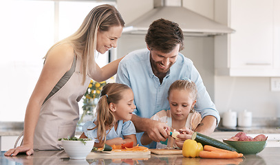 Image showing Kitchen, family and parents with children cooking with vegetables for nutrition, healthy food or meal prep. Chef skills, home and mom, dad and girls learning, teaching and helping peel ingredients