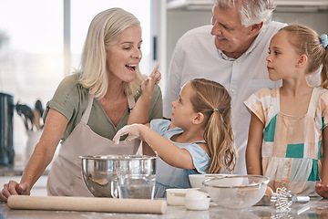 Image showing Family, playful or baking children with flour wheat in kitchen, house or home of pastry cookies, dessert cake or food. Happy, grandparents or cooking kids playing, bonding or learning bakery pudding