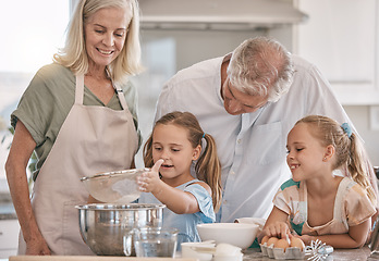 Image showing Family, baking and children helping grandparents in their home kitchen. Senior woman, man and girl kids learning about food, cooking or dessert recipe with love, care and quality time for development