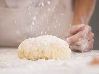 Image showing Woman hands, baking or flour sprinkle on kitchen table, countertop or desk for pastry dish, wheat cake or lunch pie food. Zoom, chef or cooking dough for bakery pudding, dessert or cookies in house