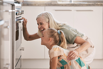 Image showing Child, girl or oven baking with grandparent, senior or elderly woman in kitchen, bonding house or family home. Happy excited or waiting cooking kid with grandmother in dessert, cake or food learning