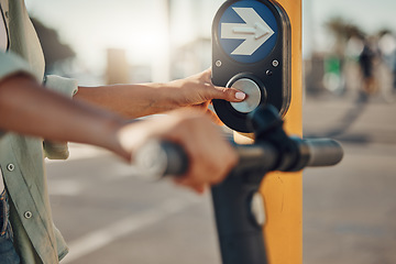 Image showing Woman, hands and pressing pedestrian crossing signal for safety, security or assurance for travel in the city. Hand of female at traffic light pushing button for crosswalk or street on electric bike