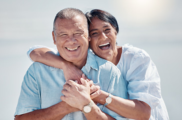 Image showing Senior couple, portrait and hug at beach for laughing, love and relax on summer holiday, vacation or date. Happy retirement, man and woman embrace at sea for happiness, support and smile in sunshine