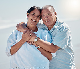 Image showing Retirement couple, portrait and hug at beach for love, care and relax on summer holiday, vacation or date. Happy senior man, woman and embrace at sea for happiness, support and smile in calm sunshine