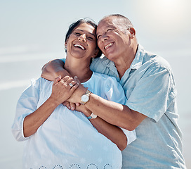 Image showing Retirement couple, laughing and hug at beach for love, care and relax on summer holiday, trust or date. Happy senior man, woman and embrace at sea for happiness, support and smile in outdoor sunshine