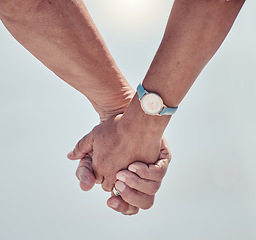 Image showing Couple holding hands with love on outdoor background for care, relationship or marriage support. Closeup hand of man, woman and people walking in nature, holiday and relax together on date of partner