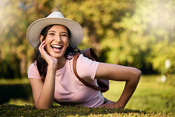 Image showing Woman, portrait and park activity of a young person happy about nature, travel and freedom. Happiness, smile and laughing female with blurred background in a garden feeling relax and summer fun