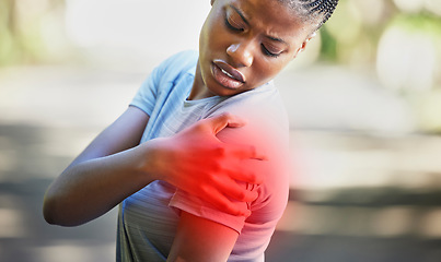 Image showing Fitness, nature and woman with shoulder pain, injury or accident while running in a park. Sports, workout and African female athlete with a medical emergency or sprain muscle after a cardio exercise.