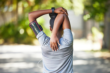 Image showing Black woman, fitness and stretching arms for running, cardio exercise or workout preparation in nature. African American female in warm up arm stretch behind back getting ready for run or training