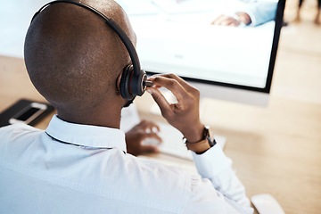 Image showing Customer support, call center and back of a male consultant doing a consultation online in office. Contact us, career and African sales man or telemarketing agent working on crm strategy in workplace