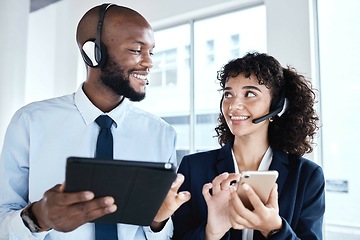 Image showing Call center employees, contact us and technology with team, tablet and smartphone with communication. CRM, customer service or tech support with telemarketing, black man and woman with teamwork