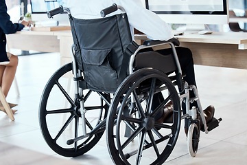 Image showing Wheelchair, office and business man disability in the workplace doing administrative assistant work. Working, computer and desk job of a worker back with technology in a coworking space with staff