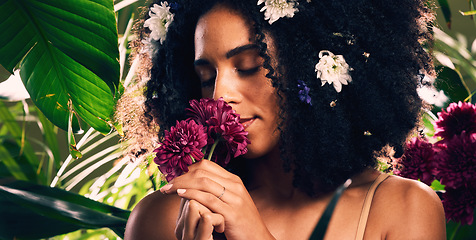 Image showing Beauty, skincare and woman smelling flowers in a organic garden for a natural floral face routine. Cosmetic, wellness and female model from Mexico enjoying the aroma of plants in a environment.